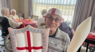 St George's Day Celebration at Drayton Village with Festive Attendee