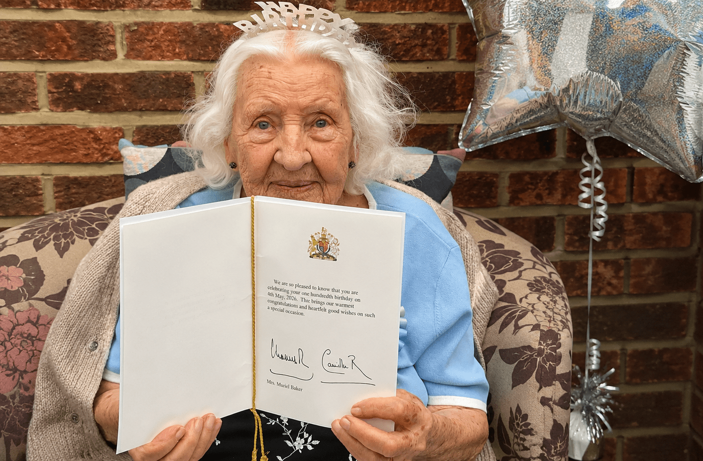 Centenarian resident celebrating 100th birthday with card