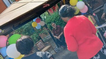 Residents enjoying outdoor BBQ at Willesden Court care home