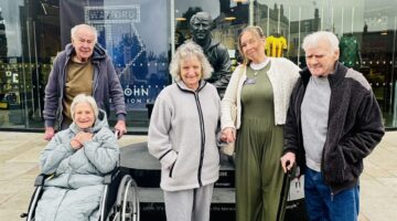 Queensway House residents enjoying a sunny day outdoors