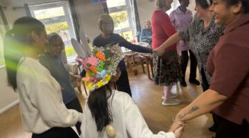 Community engagement activity with residents and staff in a care home.