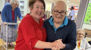 Elderly residents share a joyful VE Day dance at Lucton House