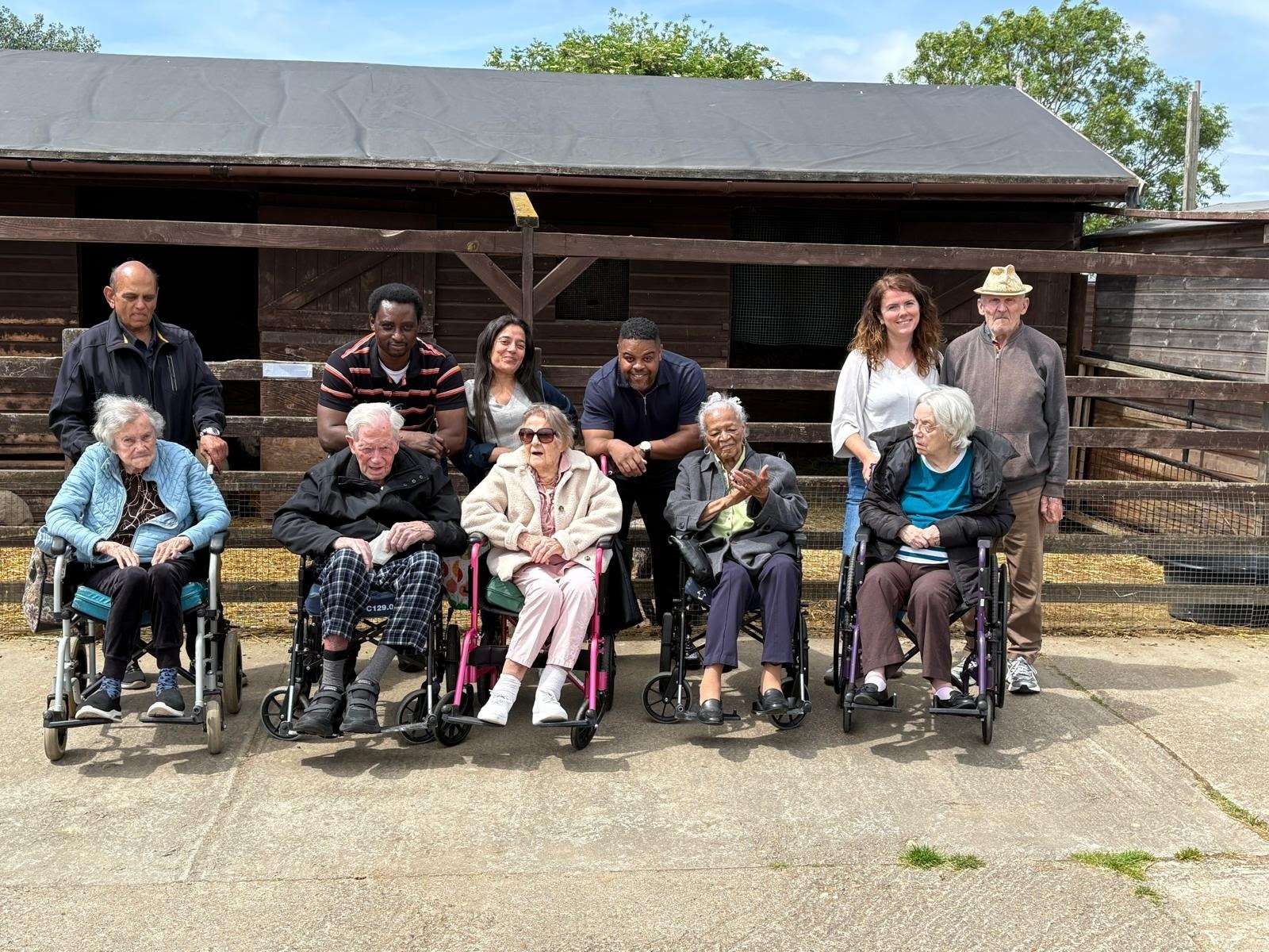 Residents in wheelchairs at Hounslow Urban Farm with Brackenbridge