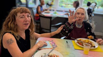 Residents and families enjoy summer lunch at Sycamore Court