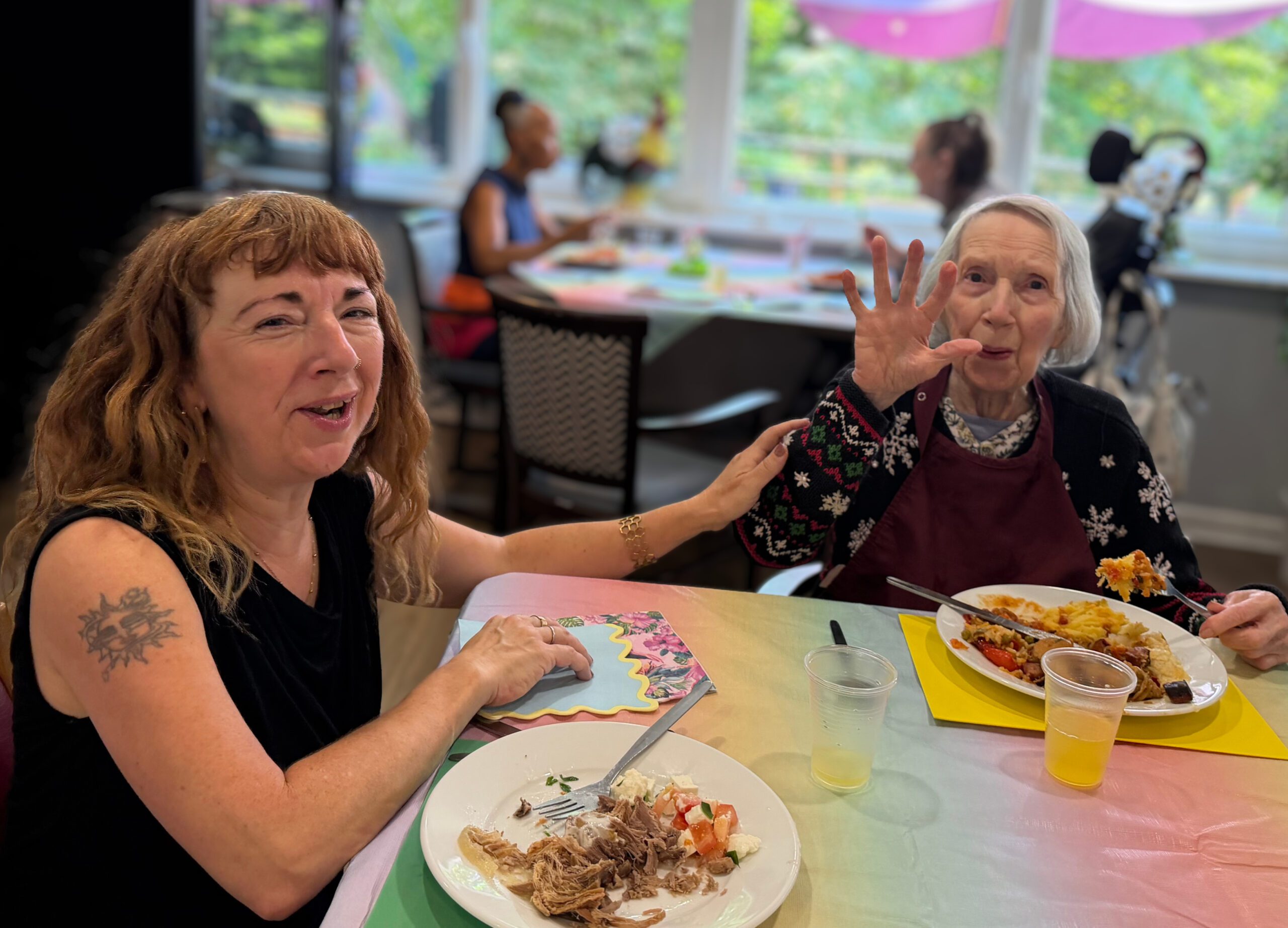 Residents and families enjoy summer lunch at Sycamore Court