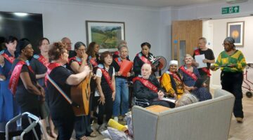 Residents and choir sing together at Willesden Court care home