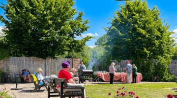 Outdoor BBQ grill sizzling at The Headington Care Home