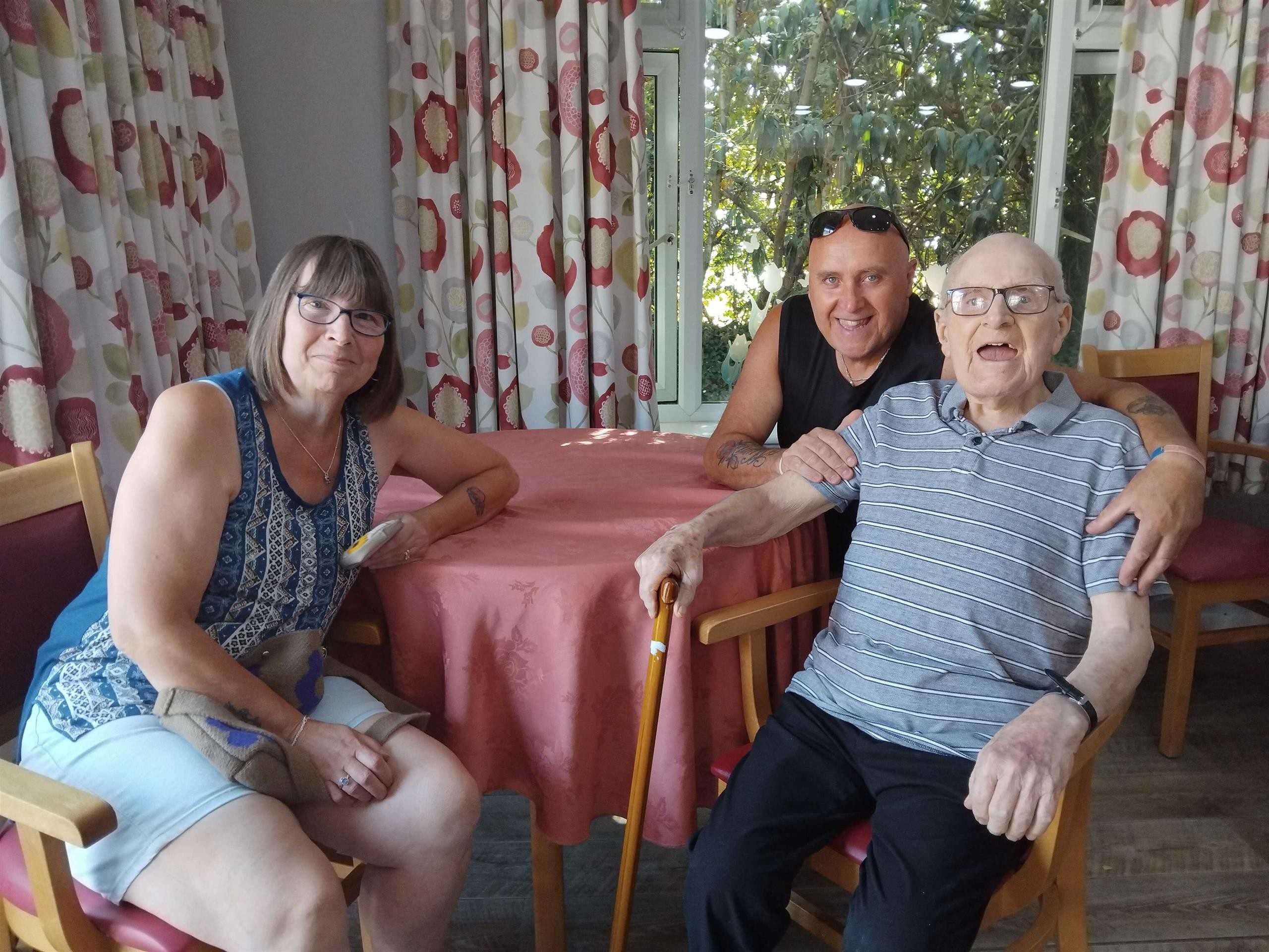 Smiling residents enjoying Martins House summer fete together