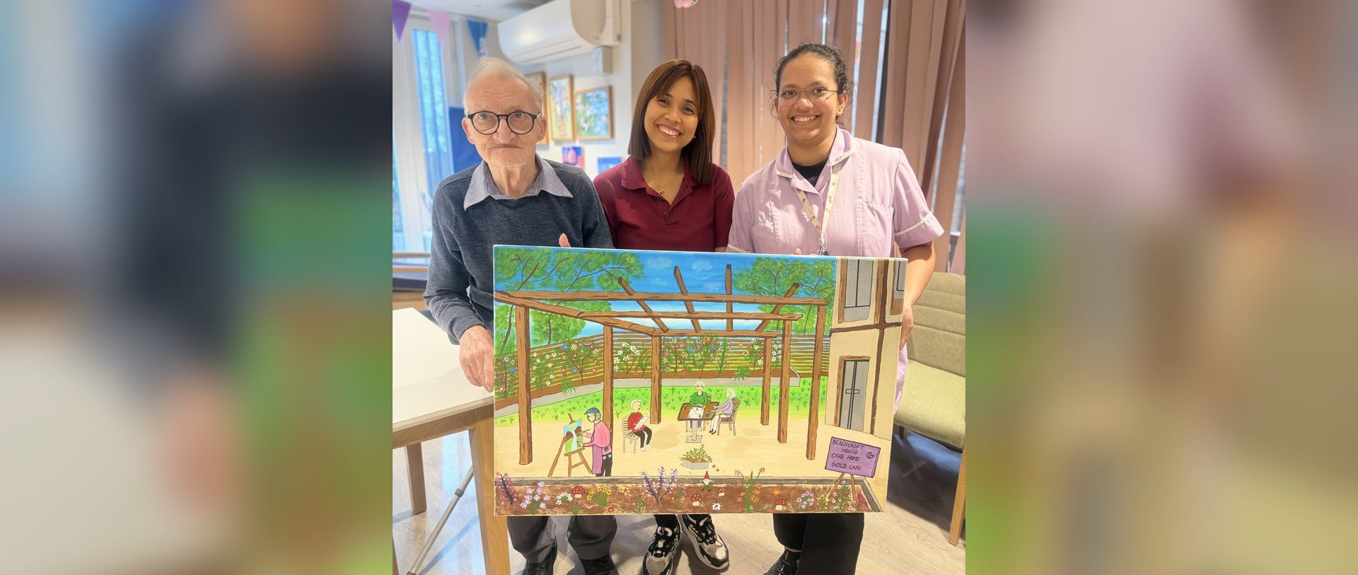 David proudly holds his Serenity artwork at Beachcroft House