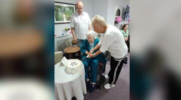 May cuts her 93rd birthday cake at Bletchley House