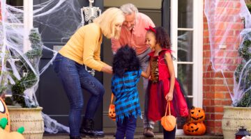 Halloween trick or treat fun with family at front door