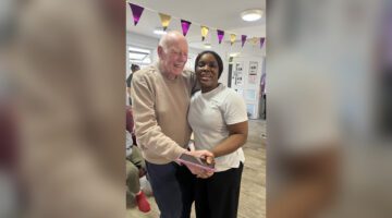 Resident couple smiling at Hillside music and dancing event