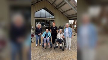 Garden centre outing: Residents pose together at The Triangle