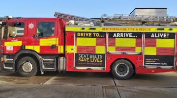 Hertfordshire Fire & Rescue fire engine with safety message